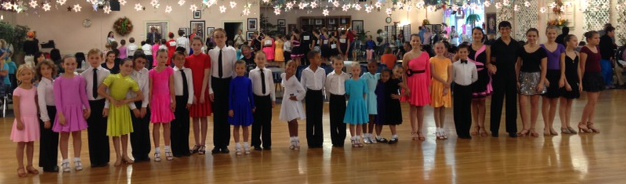 A group of children who ballroom dances